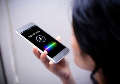 Voice search and mobile optimization in Toronto, showing near me searches and local SEO results on a smartphone